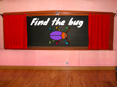 "Find the bug" text on a chalkboard on the Stage.
